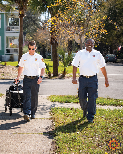 Fire Chiefs walk in Ionia Street area with smoke alarms