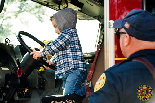 2 year old Hoke playing on the fire engine